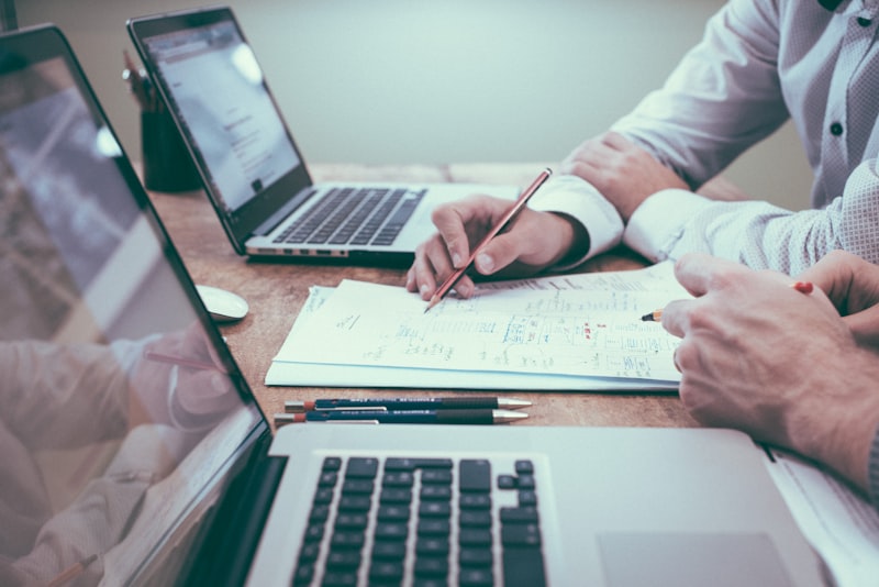 Business documents and laptops during an assessment session