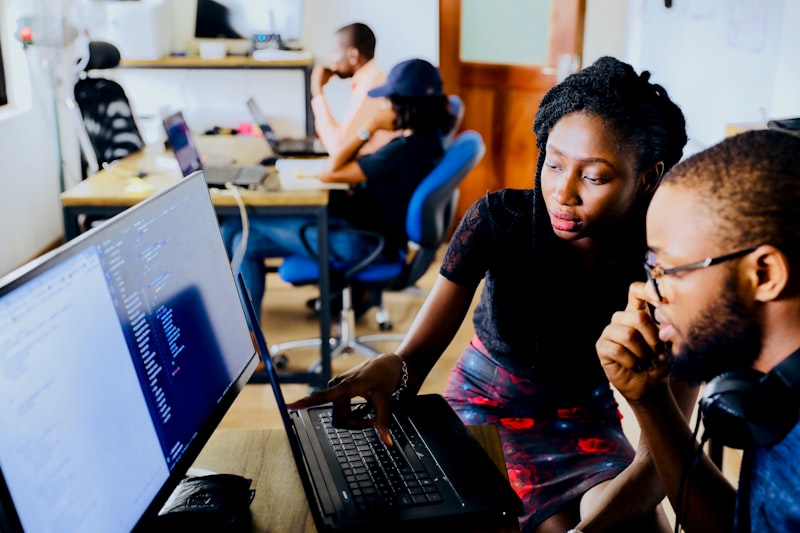 Team collaborating at a workstation